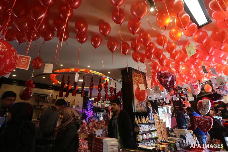 Palestinian vendors display flowers red teddy bears and pillows on Valentine's day in Gaza on February 14, 2016. Valentine's Day is increasingly popular in the region as people have taken up the custom of giving flowers,...