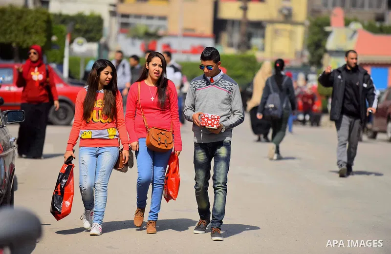Egyptian students celebrate on Valentine's day at Cairo University, in Cairo on February 14, 2016. Valentine's Day is increasingly popular in the region as people have taken up the custom of giving flowers, cards, chocol...