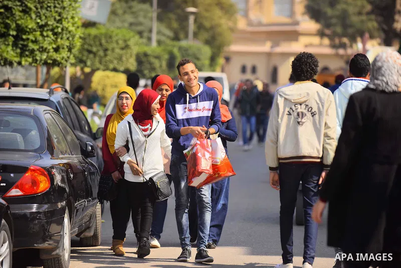 Egyptian students celebrate on Valentine's day at Cairo University, in Cairo on February 14, 2016. Valentine's Day is increasingly popular in the region as people have taken up the custom of giving flowers, cards, chocol...