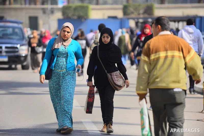 Egyptian students celebrate on Valentine's day at Cairo University, in Cairo on February 14, 2016. Valentine's Day is increasingly popular in the region as people have taken up the custom of giving flowers, cards, chocol...