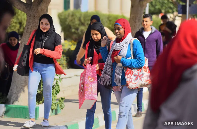 Egyptian students celebrate on Valentine's day at Cairo University, in Cairo on February 14, 2016. Valentine's Day is increasingly popular in the region as people have taken up the custom of giving flowers, cards, chocol...