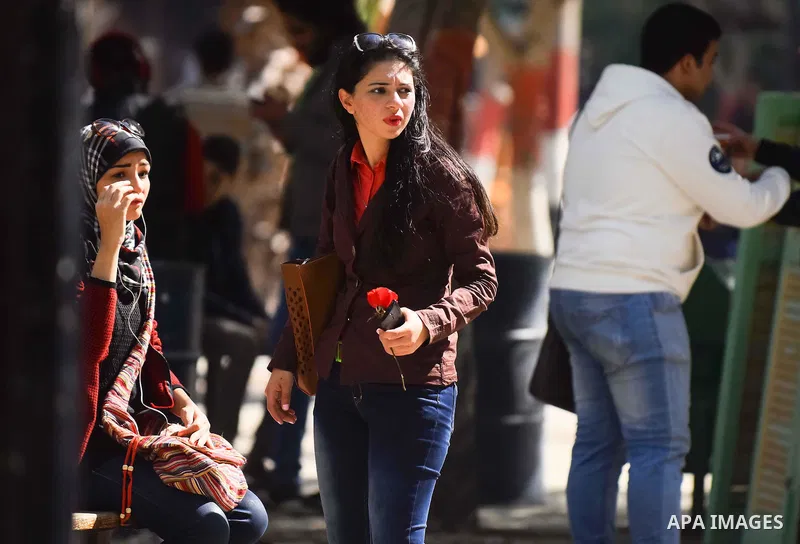 Egyptian students celebrate on Valentine's day at Cairo University, in Cairo on February 14, 2016. Valentine's Day is increasingly popular in the region as people have taken up the custom of giving flowers, cards, chocol...