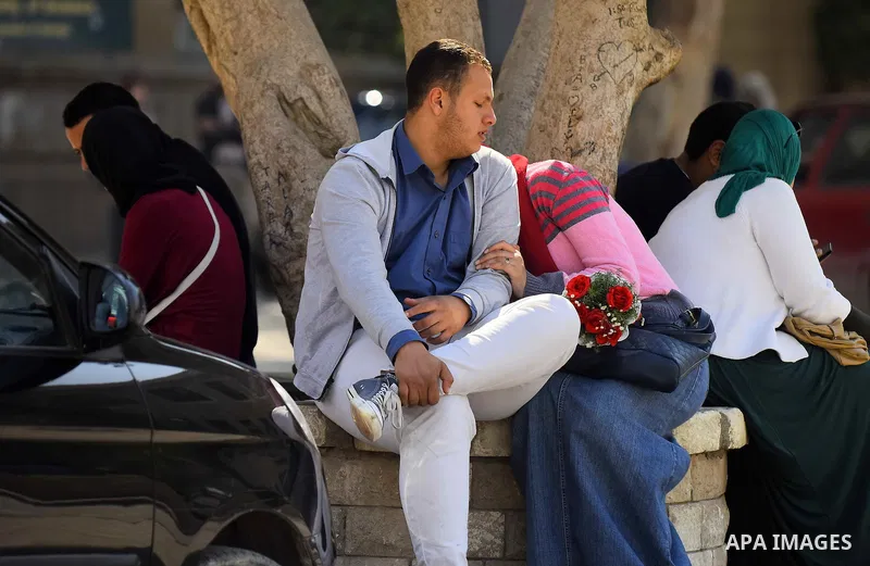 Egyptian students celebrate on Valentine's day at Cairo University, in Cairo on February 14, 2016. Valentine's Day is increasingly popular in the region as people have taken up the custom of giving flowers, cards, chocol...