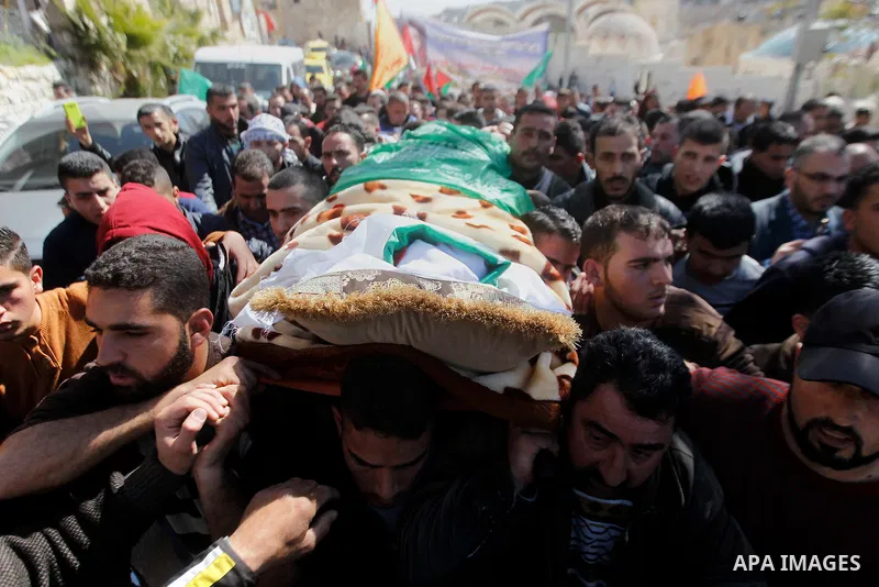 Mouerners cary the body of Kalzar al-Uweiwi, a Palestinian teenager who was killed a day earlier following a reported stabbing attack, during her funeral, in the West Bank city of Hebron, February 14, 2016. Israeli force...
