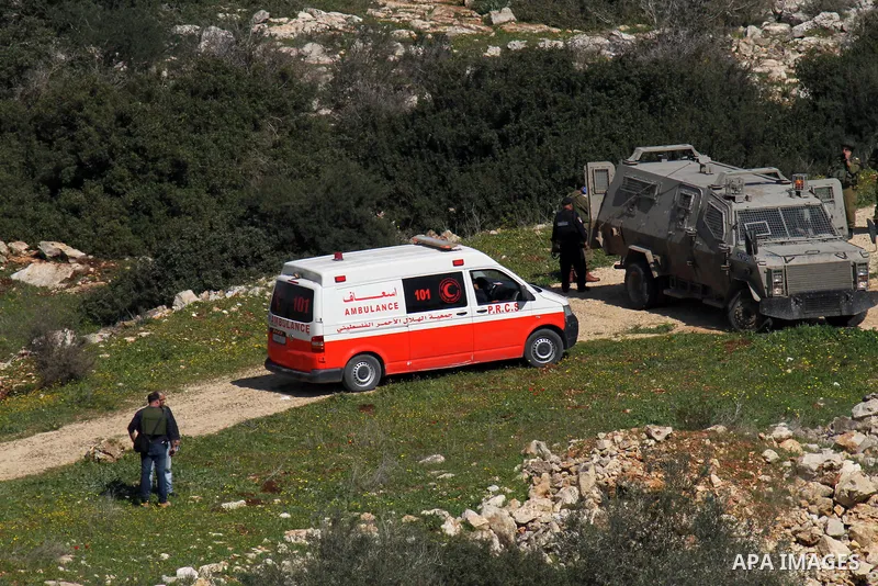 Israeli security forces inspect the area where two Palestinian teenagers were shot dead by security forces as they reported fired on Israeli soldiers on February 14, 2016 in the village of Araka, West of Jenin in the Isr...