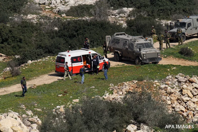 Israeli security forces inspect the area where two Palestinian teenagers were shot dead by security forces as they reported fired on Israeli soldiers on February 14, 2016 in the village of Araka, West of Jenin in the Isr...