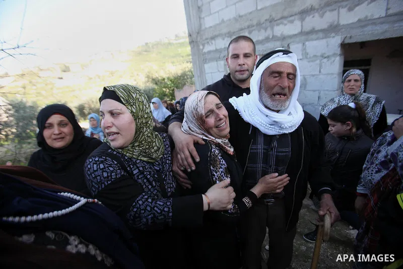 Parents of Palestinian Nihad Waked who was shot dead by Israeli security forces as they reported fired on Israeli soldiers mourn during their funeral on February 14, 2016 in the village of Araka, West of Jenin in the Isr...