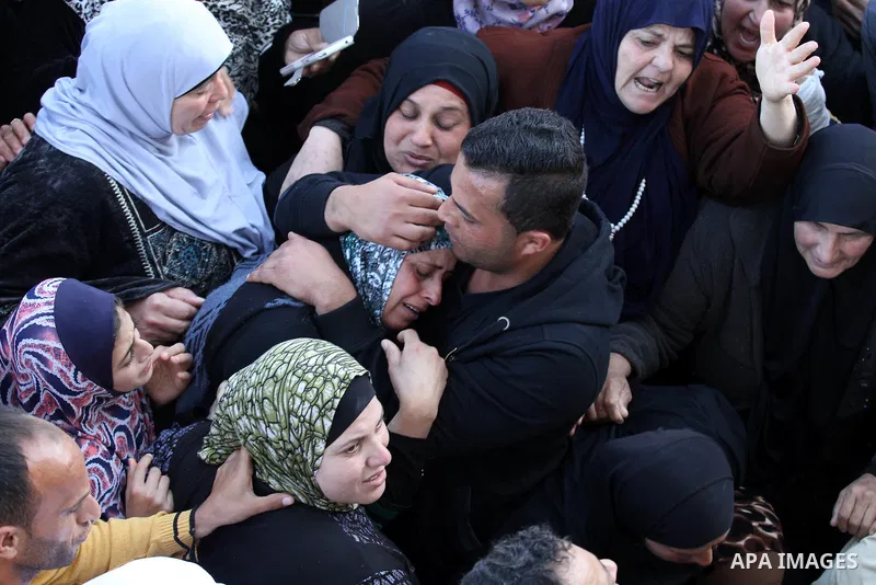 Relatives of Palestinian Nihad Waked who was shot dead by Israeli security forces as they reported fired on Israeli soldiers mourn during their funeral on February 14, 2016 in the village of Araka, West of Jenin in the I...
