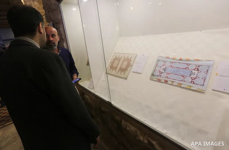 Palestinians attend the Islamic art gallery organized by the Dutch embassy in Gaza city on Feb. 16, 2016. Photo by Mohammed Asad