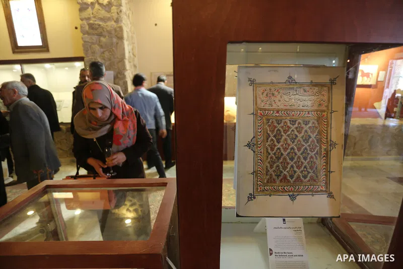 Palestinians attend the Islamic art gallery organized by the Dutch embassy in Gaza city on Feb. 16, 2016. Photo by Mohammed Asad