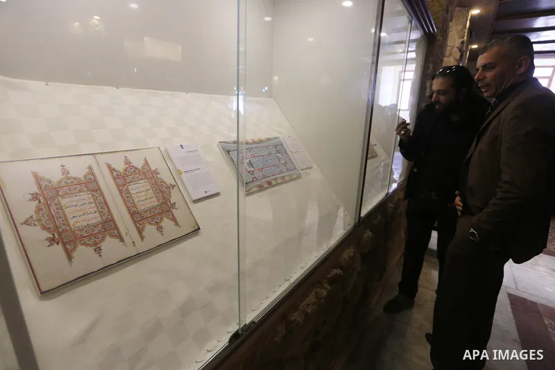 Palestinians attend the Islamic art gallery organized by the Dutch embassy in Gaza city on Feb. 16, 2016. Photo by Mohammed Asad