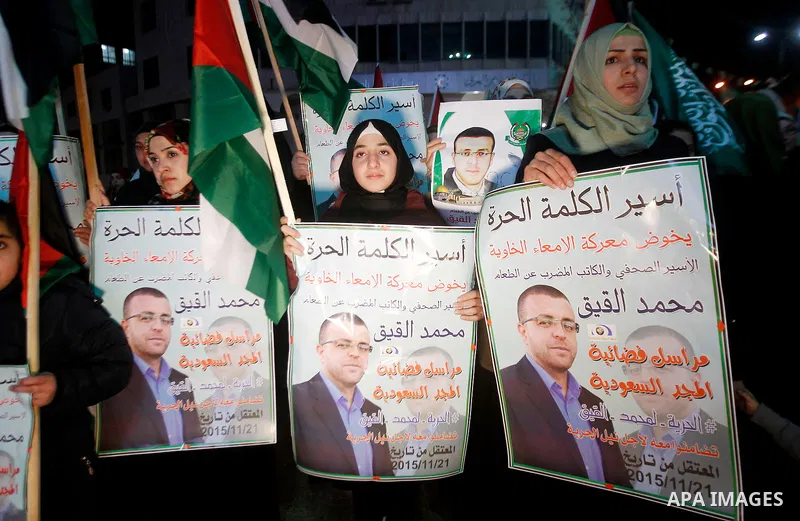 Palestinians take part in a demonstration calling for the release of Mohammed al-Qiq, a Palestinian prisoner on hunger strike, in the West bank city of Hebron on February 16, 2016. Israel's top court rejected Qiq's reque...