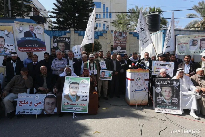 Palestinians hold posters during a protest in support of hunger striking Palestinian journalist Mohammed al-Qiq, in Gaza city on February 17, 2016. Israel's top court rejected Qiq's request to be moved to the West Bank f...