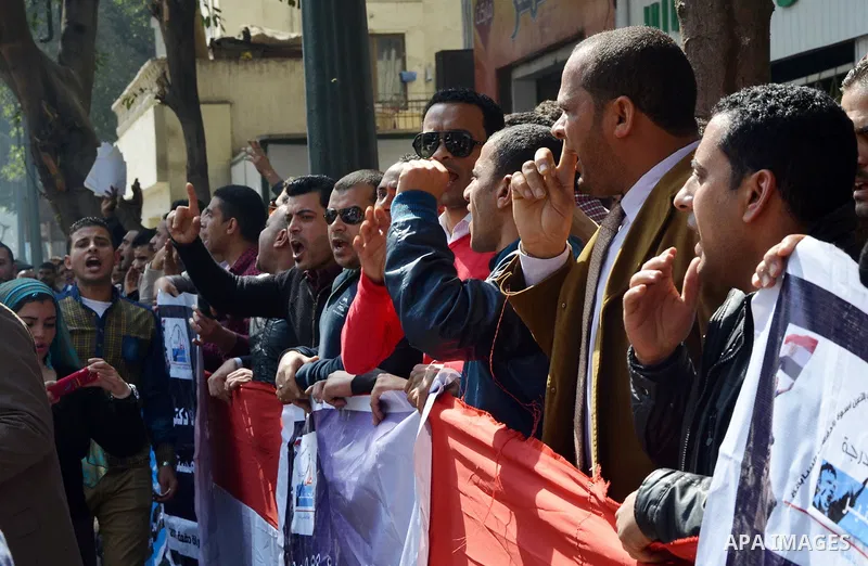 Egyptians take part in a protest to demand jobs in front of the Council of Ministers, in Cairo, Egypt, on February 17, 2016. Photo by Amr Sayed