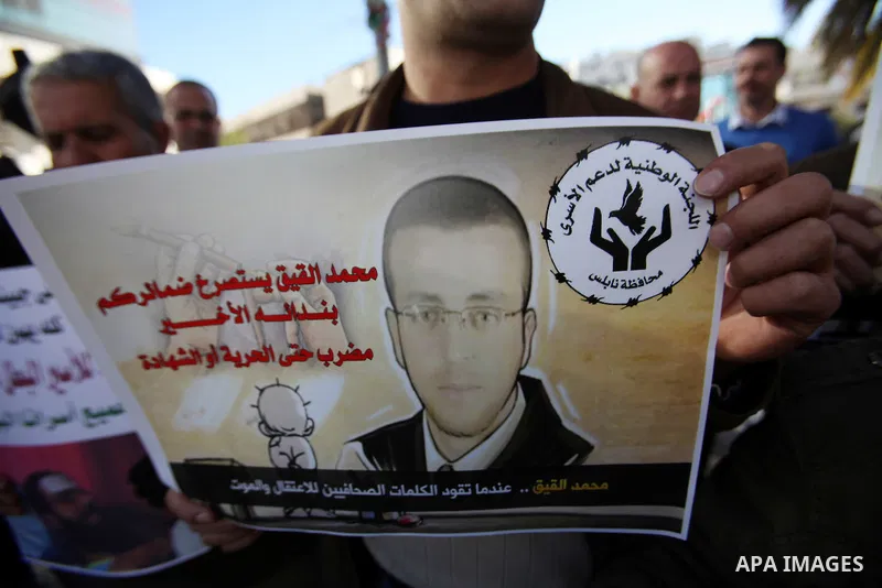 Palestinians take part in a demonstration calling for the release of Mohammed al-Qiq, a Palestinian prisoner on hunger strike, in the West bank city of Nablus on February 17, 2016. Israel's top court rejected Qiq's reque...