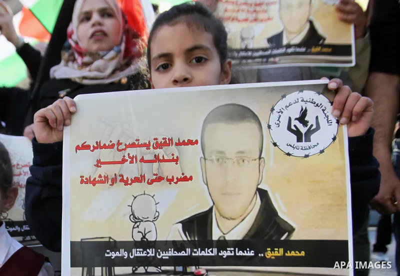 Palestinians take part in a demonstration calling for the release of Mohammed al-Qiq, a Palestinian prisoner on hunger strike, in the West bank city of Nablus on February 17, 2016. Israel's top court rejected Qiq's reque...