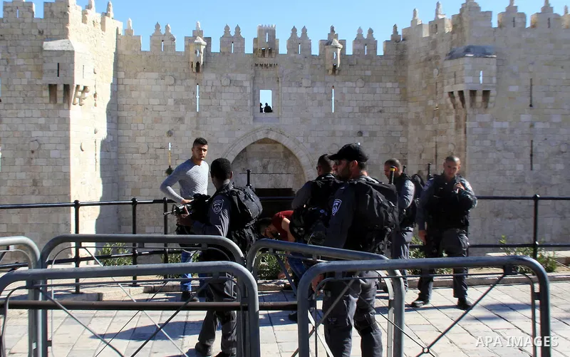 Israeli border policemen perform a body search on a Palestinian youth at Damascus Gate in Jerusalem's Old City February 17, 2016. Photo by Mahfouz Abu Turk