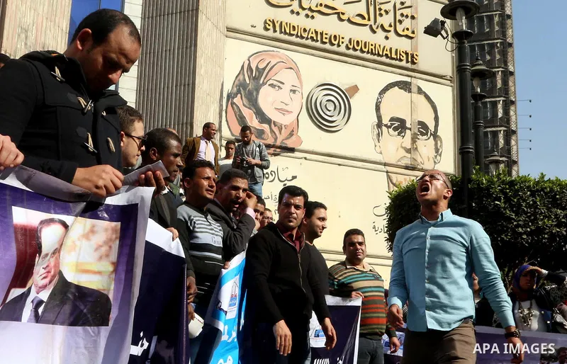 Egyptians take part in a protest to demand jobs in front of the journalists syndicate, in Cairo, Egypt, on February 17, 2016. Photo by Alaa Elkassas