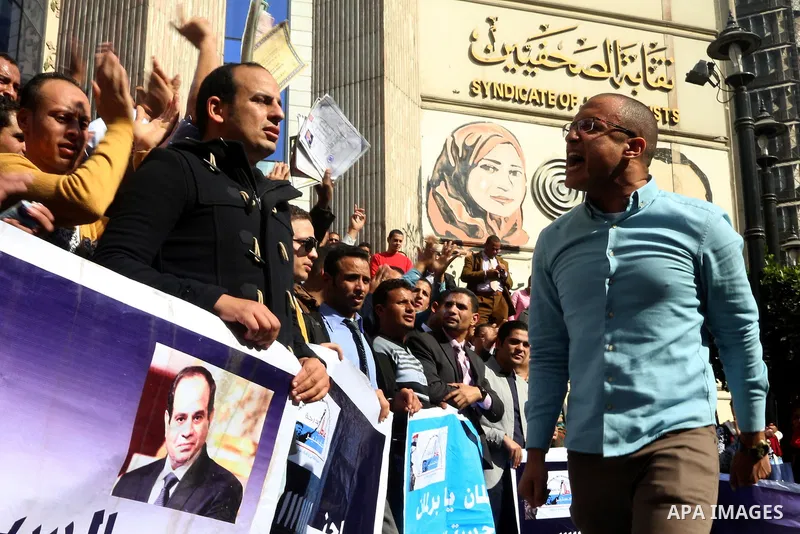 Egyptians take part in a protest to demand jobs in front of the journalists syndicate, in Cairo, Egypt, on February 17, 2016. Photo by Alaa Elkassas