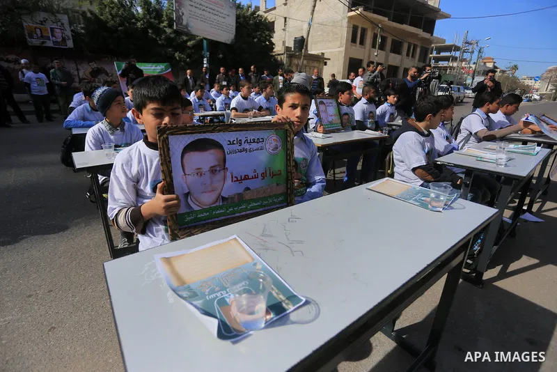 Palestinian students take part in a demonstration calling for the release of Mohammed al-Qiq, a Palestinian prisoner on hunger strike, in front of Red cross office in Gaza city, on February 18, 2016. Israel's top court r...