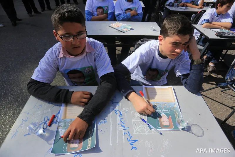 Palestinian students take part in a demonstration calling for the release of Mohammed al-Qiq, a Palestinian prisoner on hunger strike, in front of Red cross office in Gaza city, on February 18, 2016. Israel's top court r...