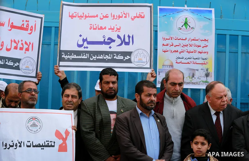 Palestinians take part in a protest against reductions of the services and aid offered by United Nations Relief and Works Agency (UNRWA), in front of UNRWA headquarters in Gaza City on February 18, 2016. Photo by Yasser...