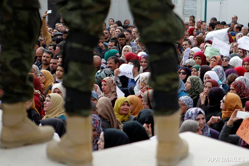 Palestinian teachers take part in a protest to demand their rights, in the West bank city of Hebron, on February 18, 2016. Photo by Wisam Hashlamoun