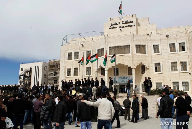 Palestinian teachers take part in a protest to demand their rights, in the West bank city of Hebron, on February 18, 2016. Photo by Wisam Hashlamoun
