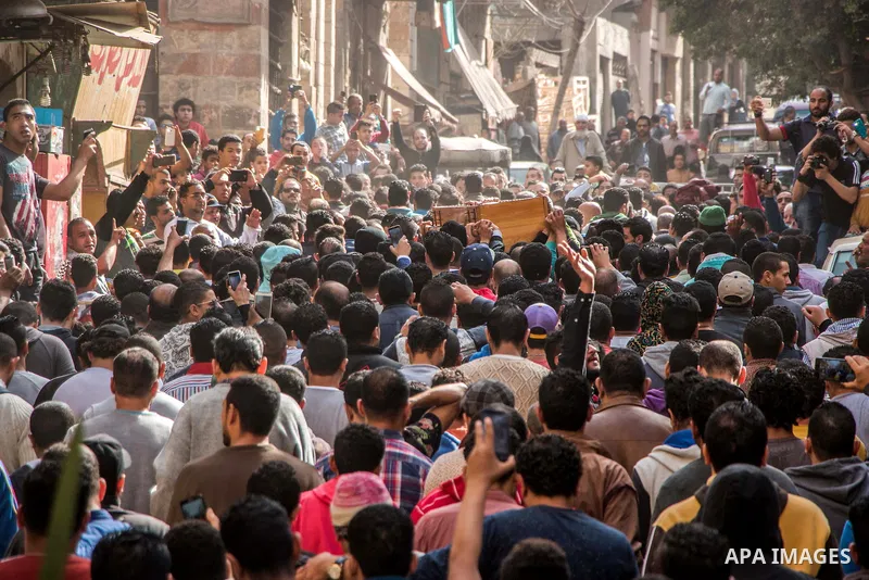 Egyptian mourners carry the coffin of the driver Mohammed Adel who killed by police officer in a dispute in Cairo's el-Darb el-Ahmar district on Feb. 19, 2016. Photo by Amr Sayed