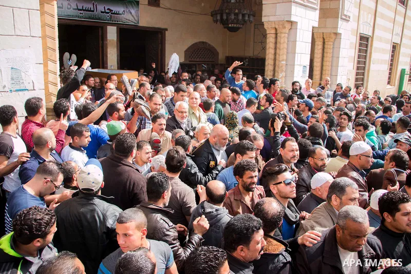 Egyptian mourners carry the coffin of the driver Mohammed Adel who killed by police officer in a dispute in Cairo's el-Darb el-Ahmar district on Feb. 19, 2016. Photo by Amr Sayed