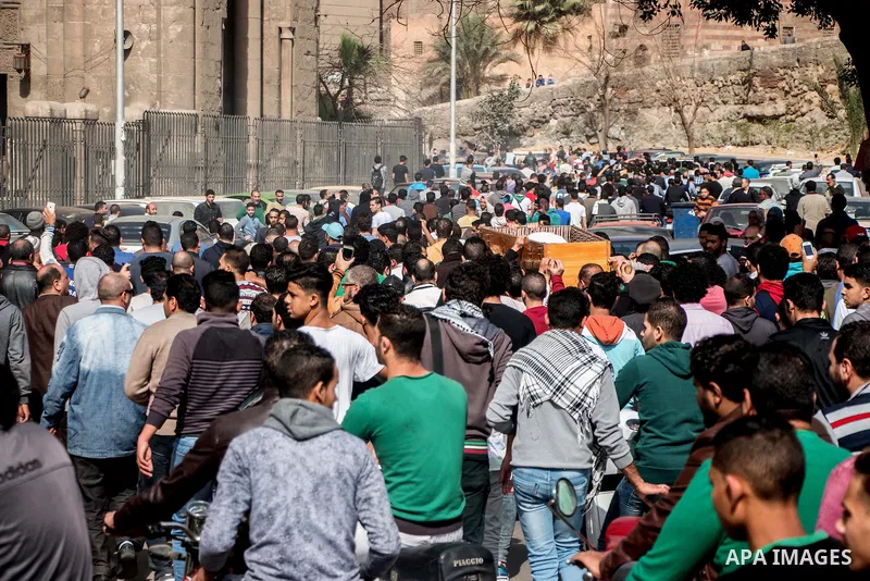 Egyptian mourners carry the coffin of the driver Mohammed Adel who killed by police officer in a dispute in Cairo's el-Darb el-Ahmar district on Feb. 19, 2016. Photo by Amr Sayed