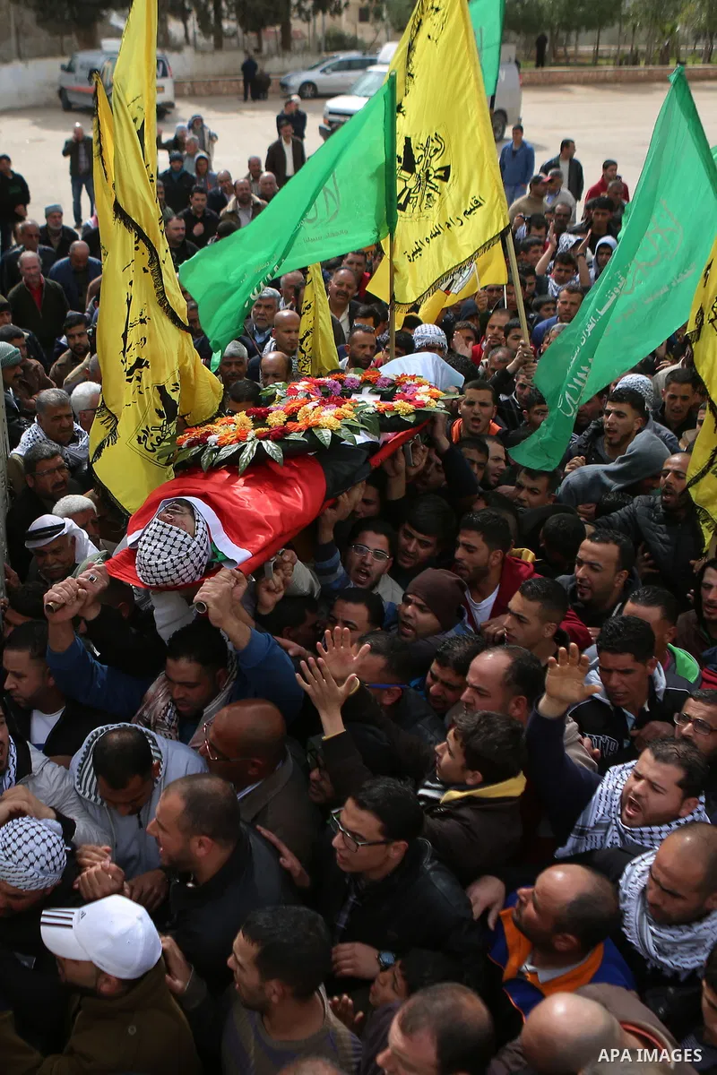 Mourners carry the body of Abed Hammad, 20, who was shot dead by Israeli forces, during his funeral in the West Bank village of Silwad, Feb. 20, 2016. Hammad was one of three Palestinians to be killed by Israeli forces o...