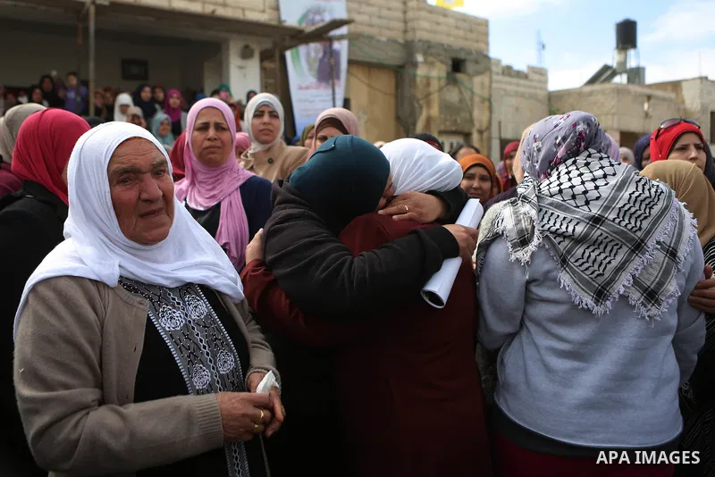 Relatives of Abed Hammad, 20, who was shot dead by Israeli forces, mourn during his funeral in the West Bank village of Silwad, Feb. 20, 2016. Hammad was one of three Palestinians to be killed by Israeli forces on Friday...