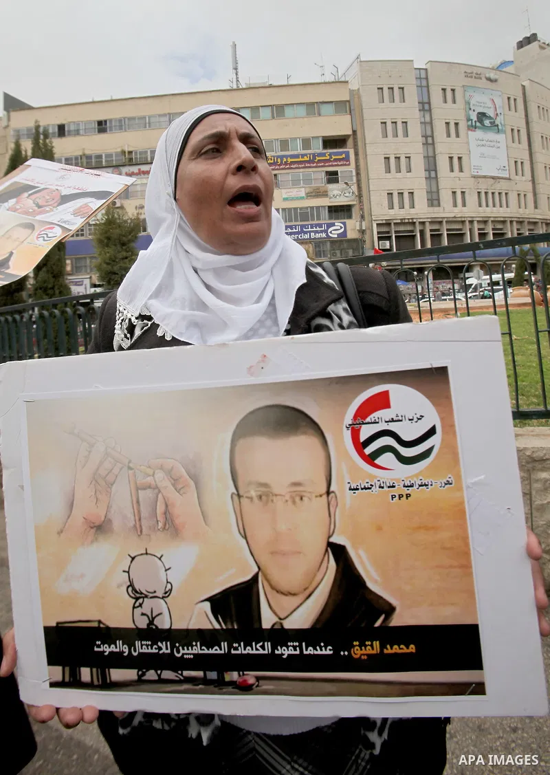 Palestinians chant slogans during a protest to demand the boycott of Israeli goods in the West bank city of Nablus, on Feb. 20, 2016. Photo by Nedal Eshtayah