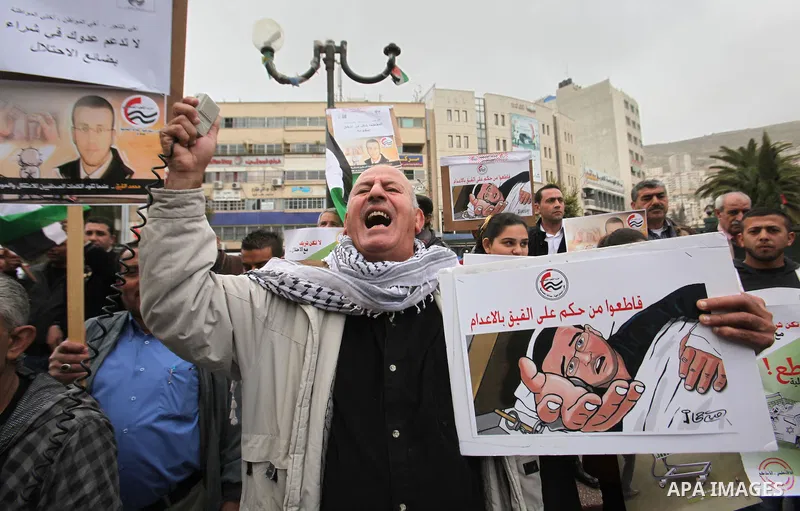 Palestinians chant slogans during a protest to demand the boycott of Israeli goods in the West bank city of Nablus, on Feb. 20, 2016. Photo by Nedal Eshtayah