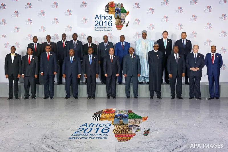 A handout photograph made available by the Egyptian Presidency shows Egyptian President Abdel Fattah al-Sisi (C) takes part in a group photograph with Presidents and delegations before the opening session of the 'Africa...