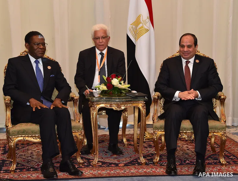 A handout photograph made available by the Egyptian Presidency shows shows Egyptian President Abdel Fattah al-Sisi (R) meeting with Equatorial Guinea's President Teodoro Obiang Nguema Mbasogo after the opening session of...