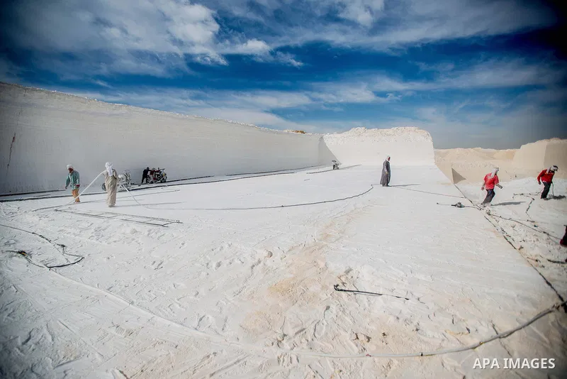 Egyptian Labourers work at a quarry in the desert of Minya governorate, south of Cairo, Egypt, on Feb 20, 2016. In the limestone quarries of Minya province south of Cairo, labourers in sandals and makeshift masks use uns...