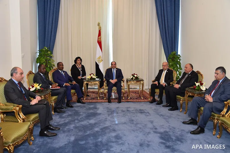 A handout photograph made available by the Egyptian Presidency shows shows Egyptian President Abdel Fattah al-Sisi (R) meeting with Prime Minister of Togo Kumi Silom Claso after the opening session of the 'Africa 2016, B...
