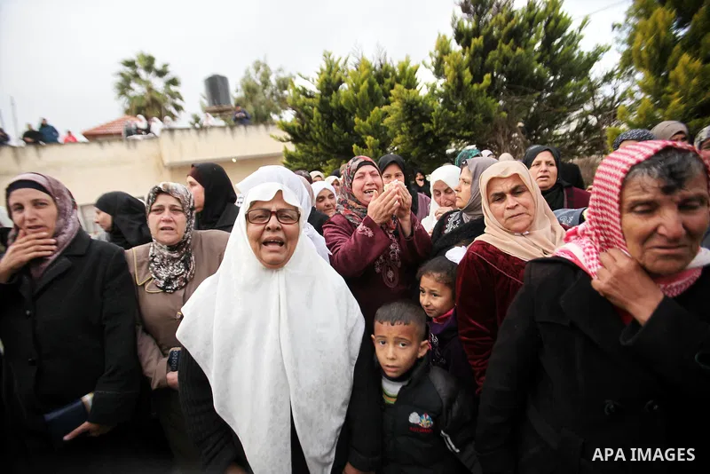 Relatives of Palestinian teenager Qusay Abo Alrob, 16, whom the Israeli military said was shot dead by Israeli troops after he tried to stab a soldier on Sunday mourn during his funeral in the West Bank town of Qabatya n...