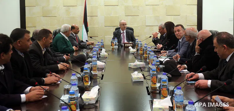 Palestinian Prime Minister Rami Hamdallah meets with a delegation of representatives of the private sector in the Gaza Strip at his office in the West Bank city of Ramallah, on Feb. 22, 2016. Photo by Prime Minister Offi...