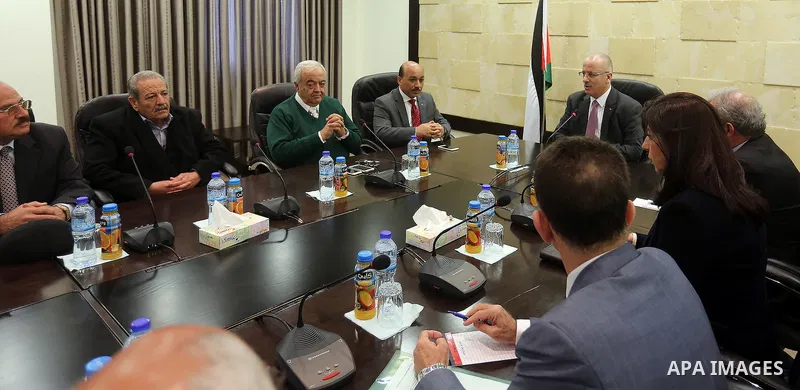 Palestinian Prime Minister Rami Hamdallah meets with a delegation of representatives of the private sector in the Gaza Strip at his office in the West Bank city of Ramallah, on Feb. 22, 2016. Photo by Prime Minister Offi...