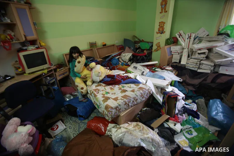 A Palestinian girl looks at the bedroom after Israeli troops searched apartments belonging to a same family during an operation to arrest wanted Palestinians in the Askar refugee camp, near Nablus in the Israeli occupied...