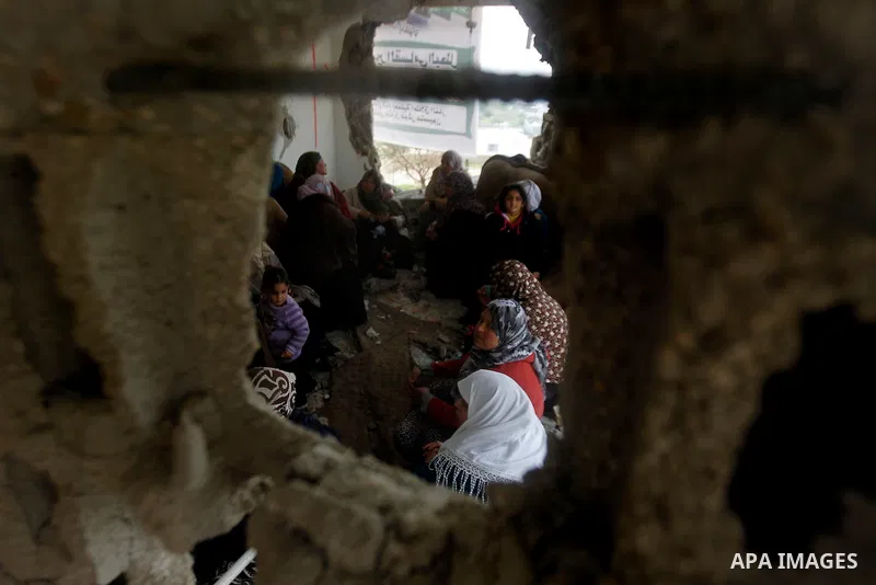 Palestinians check the damage in a house after it was partially demolished by Israeli forces in the West Bank village of Deir Samit, south of Hebron February 23, 2016. Israeli army on Tuesday demolished houses of two Pal...