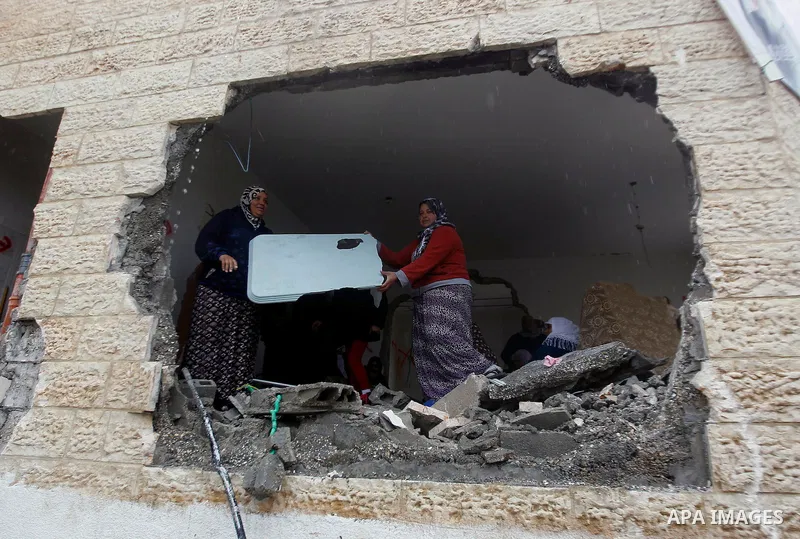 Palestinians check the damage in a house after it was partially demolished by Israeli forces in the West Bank village of Deir Samit, south of Hebron February 23, 2016. Israeli army on Tuesday demolished houses of two Pal...