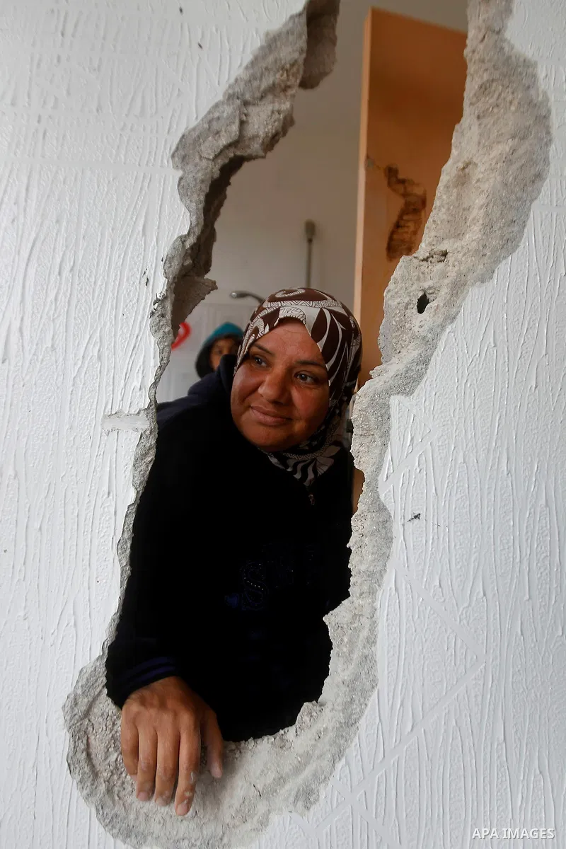 Palestinians check the damage in a house after it was partially demolished by Israeli forces in the West Bank village of Deir Samit, south of Hebron February 23, 2016. Israeli army on Tuesday demolished houses of two Pal...