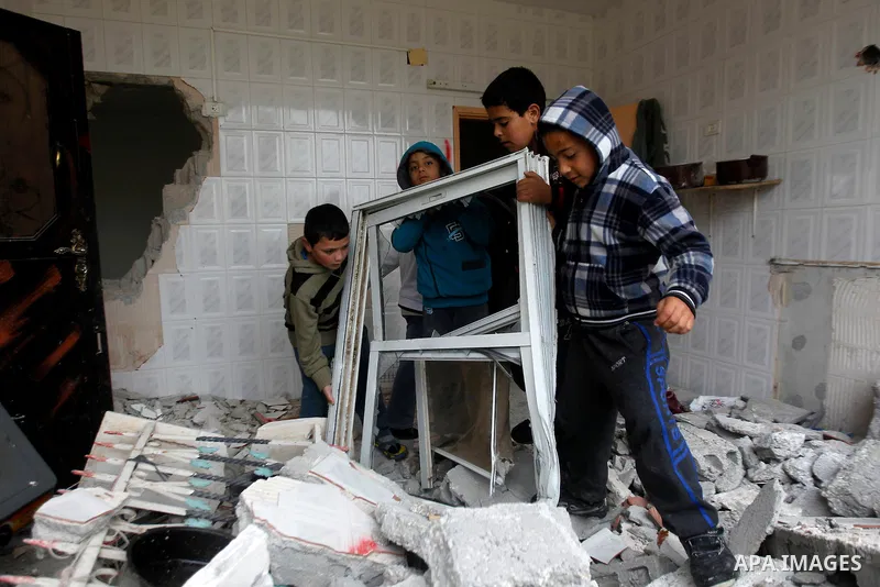 Palestinians check the damage in a house after it was partially demolished by Israeli forces in the West Bank village of Deir Samit, south of Hebron February 23, 2016. Israeli army on Tuesday demolished houses of two Pal...