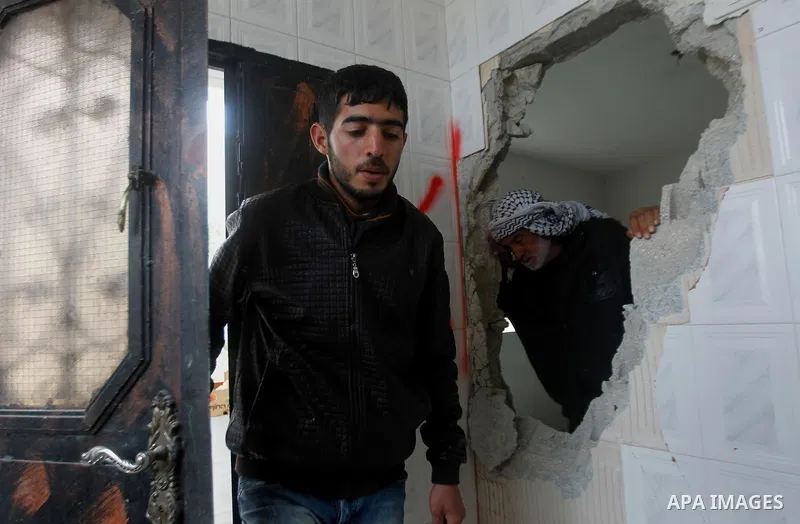 Palestinians check the damage in a house after it was partially demolished by Israeli forces in the West Bank village of Deir Samit, south of Hebron February 23, 2016. Israeli army on Tuesday demolished houses of two Pal...