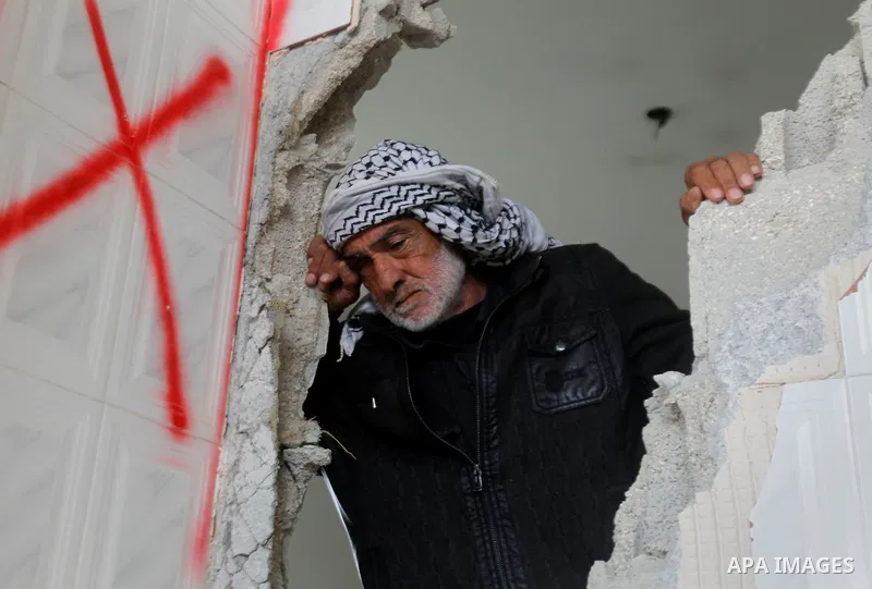 Palestinians check the damage in a house after it was partially demolished by Israeli forces in the West Bank village of Deir Samit, south of Hebron February 23, 2016. Israeli army on Tuesday demolished houses of two Pal...