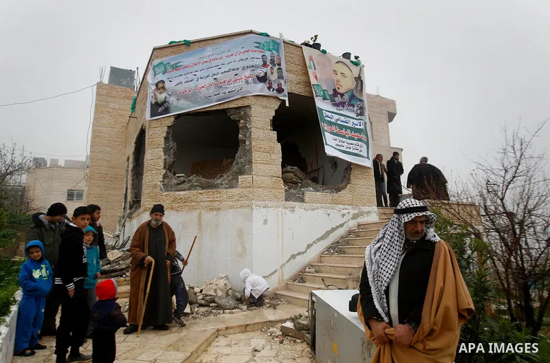 Palestinians check the damage in a house after it was partially demolished by Israeli forces in the West Bank village of Deir Samit, south of Hebron February 23, 2016. Israeli army on Tuesday demolished houses of two Pal...